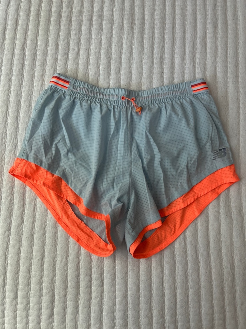 New Balance Light Blue Mesh Running Shorts with Orange Eyelets
